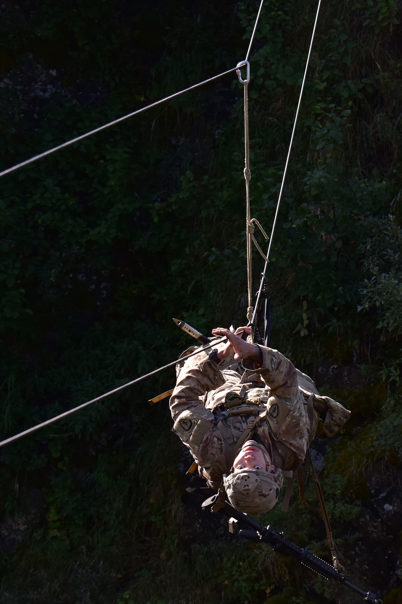 Basic Military Mountaineering Course student Spc. Kevin Vang crosses a rope bridge over a mountain gorge at the Northern Warfare Training Center’s Black Rapids Site during training. NWTC cadre followed Coronavirus restrictions while guiding students through both the basic and advanced mountaineering courses in August. With the advent of Alaska’s long, cold winter, NWTC’s focus is now shifting to cold weather training for the 2020-21 season.