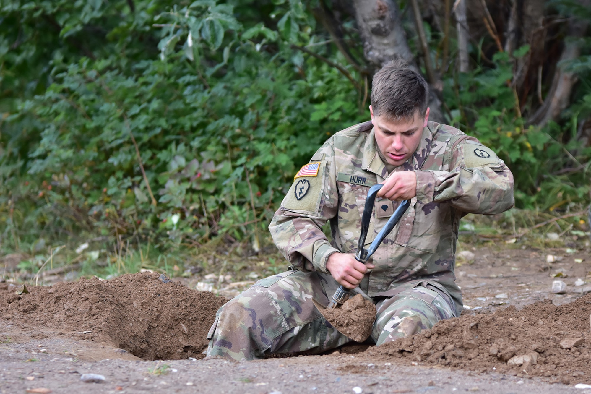 Spc. Jadyn Hurr digs a hole to create an anchor point for climbing and rappelling at the Northern Warfare Training Center’s Black Rapids Site during training. NWTC cadre followed Coronavirus restrictions while guiding students through both the basic and advanced mountaineering courses in August. With the advent of Alaska’s long, cold winter, NWTC’s focus is now shifting to cold weather training for the 2020-21 season.
