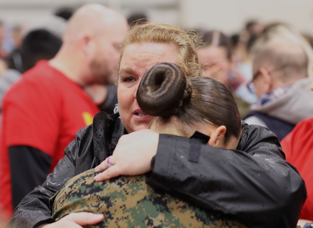 Marines embrace their loved ones during Family Day at Marine Corps Recruit Depot Parris Island, S.C., March 5.