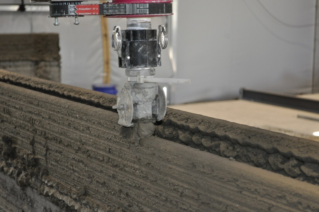 The U.S. Army Engineer Research and Development Center, Construction Engineer Research Laboratory’s concrete 3D printing apparatus precisely lines up individual concrete layers during the printing process.
