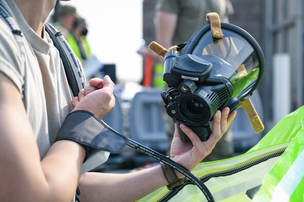 Airman 1st Class David Chen, a 460th Operational Medical Readiness Squadron technician, receives a cursory blood pressure check before going in to a hazmat incident during the Ready Eagle exercise where a simulated explosion occurred Sept. 18, 2020, at the Air Reserve Personnel Center on Buckley Air Force Base, Colo.