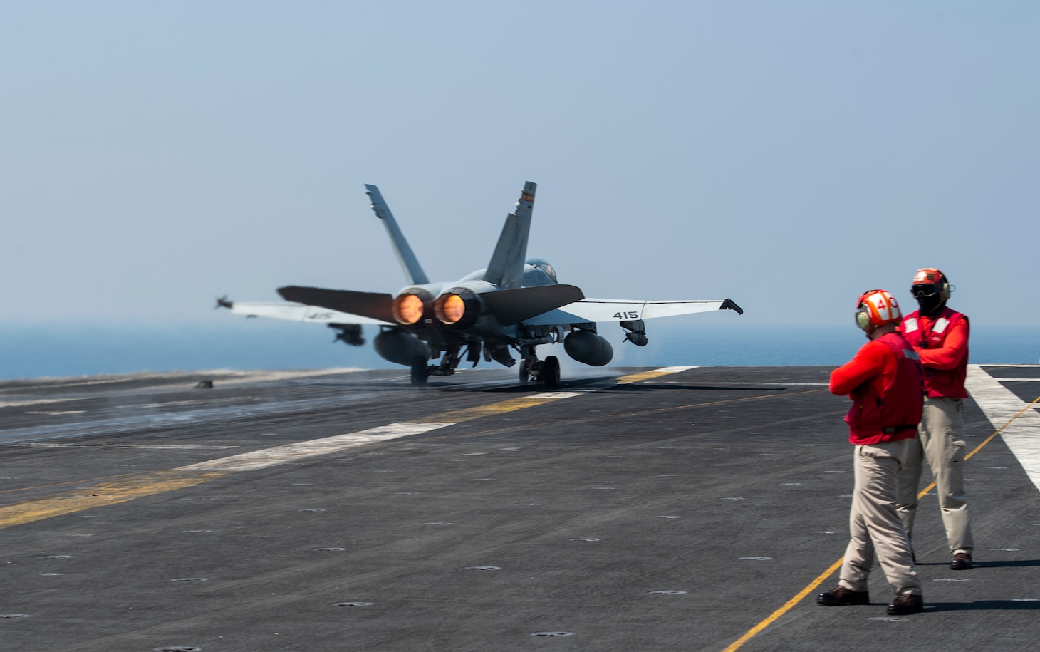 An F/A-18C Hornet, assigned to the "Death Rattlers" of Marine Fighter Attack Squadron (VMFA) 323, launches from the flight deck of the aircraft carrier USS Nimitz (CVN 68) in support of Operation Inherent Resolve.