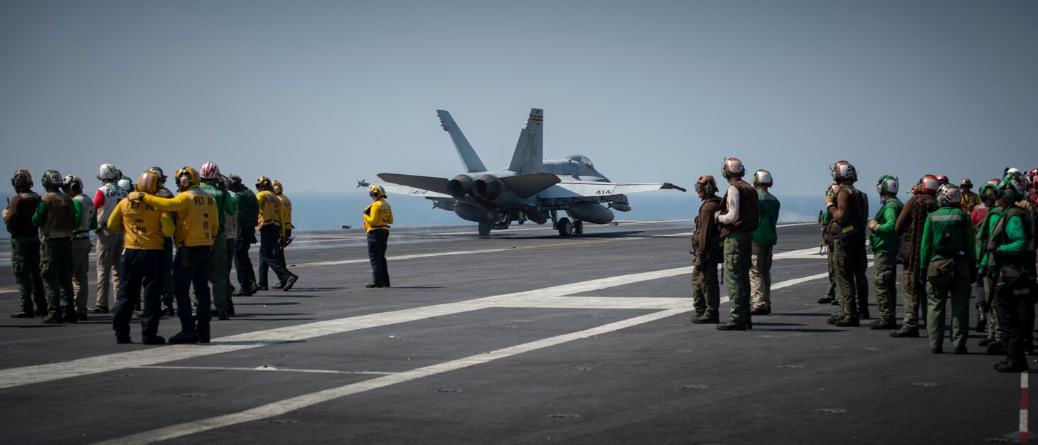 An F/A-18C Hornet, assigned to the "Death Rattlers" of Marine Fighter Attack Squadron (VMFA) 323, launches from the flight deck of the aircraft carrier USS Nimitz (CVN 68) in support of Operation Inherent Resolve.