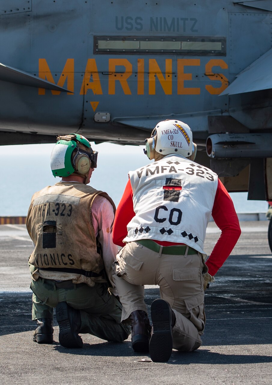 U.S. Marines conduct flight operations on the flight deck of the aircraft carrier USS Nimitz (CVN 68) in support of Operation Inherent Resolve.