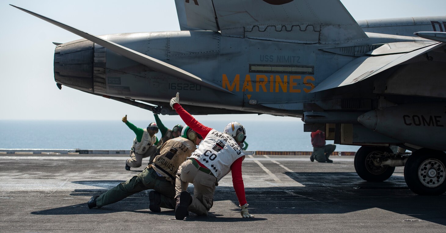 U.S. Marines conduct flight operations on the flight deck of the aircraft carrier USS Nimitz (CVN 68) in support of Operation Inherent Resolve.