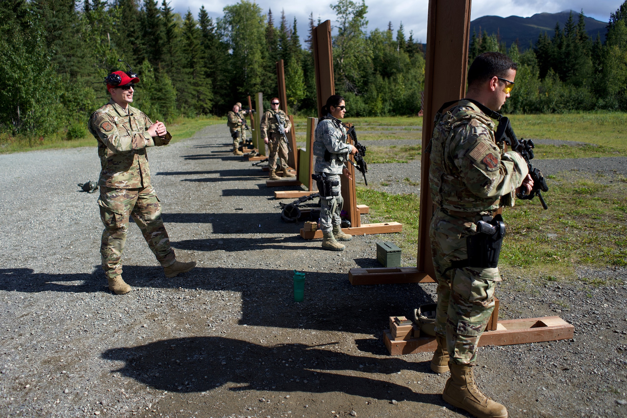 Alaska Air National Guard Tech. Sgt. Brian Sears, a combat arms training and maintenance instructor with 176th Security Forces Squadron, coaches Airmen of 176th SFS in M4 carbine marksmanship skills Aug. 27, 2020, at Joint Base Elmendorf-Richardson. CATM instructors are specially trained Security Forces Defenders who train others to ably employ small arms.