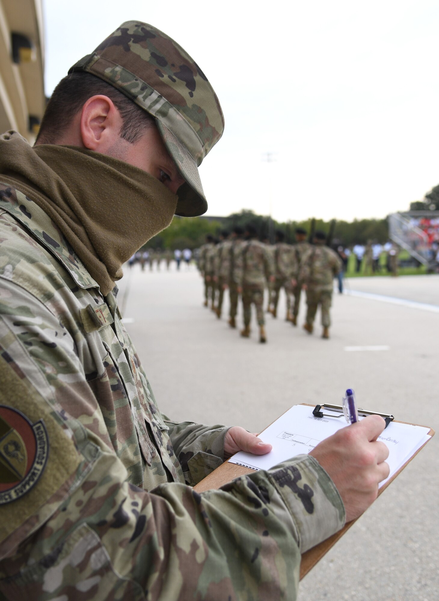 U.S. Air Force Tech. Sgt. Nathan Bentley, Keesler Honor Guard member, judges the 81st Training Group drill down on the Levitow Training Support Facility drill pad at Keesler Air Force Base, Mississippi, Sept. 18, 2020. Airmen from the 81st TRG competed in a quarterly open ranks inspection, regulation drill routine and freestyle drill routine. Keesler trains more than 30,000 students each year. While in training, Airmen are given the opportunity to volunteer to learn and execute drill down routines. (U.S. Air Force photo by Kemberly Groue)