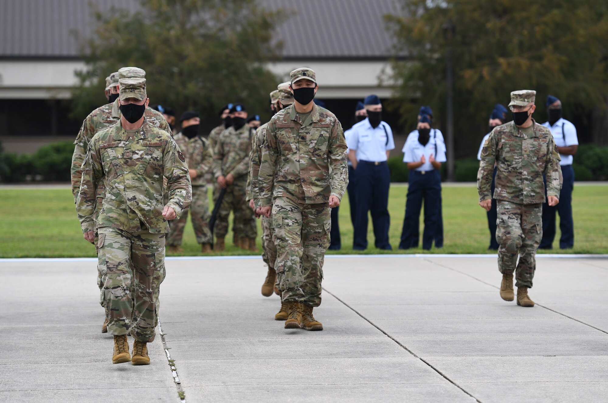 Leadership from the 81st Training Group showcase a regulation drill performance during the 81st TRG drill down on the Levitow Training Support Facility drill pad at Keesler Air Force Base, Mississippi, Sept. 18, 2020. Airmen from the 81st TRG competed in a quarterly open ranks inspection, regulation drill routine and freestyle drill routine. Keesler trains more than 30,000 students each year. While in training, Airmen are given the opportunity to volunteer to learn and execute drill down routines. (U.S. Air Force photo by Kemberly Groue)