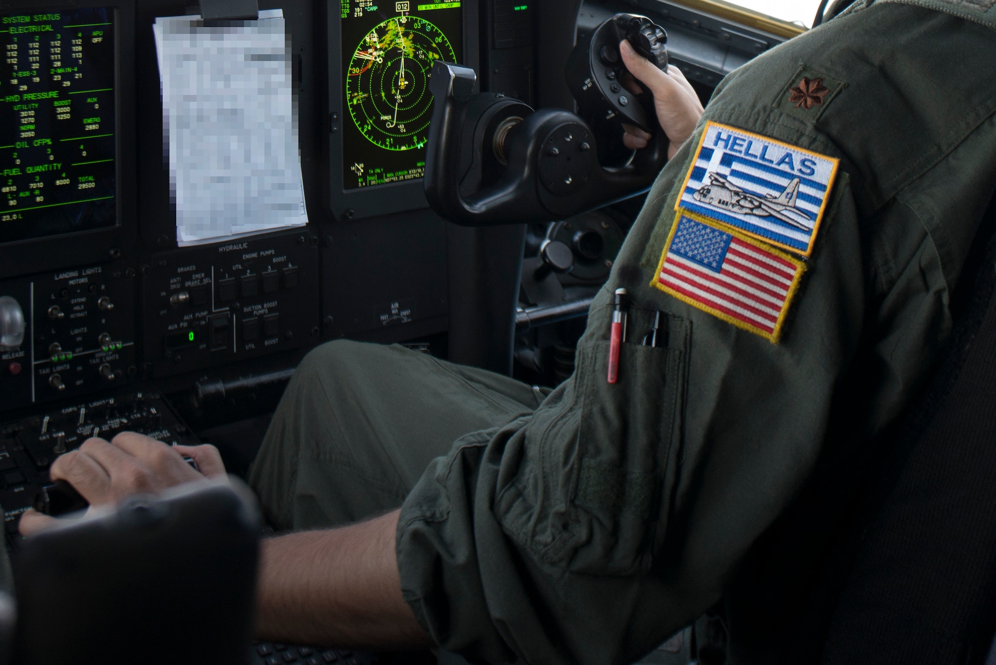 A pilot flies a C-130J aircraft.