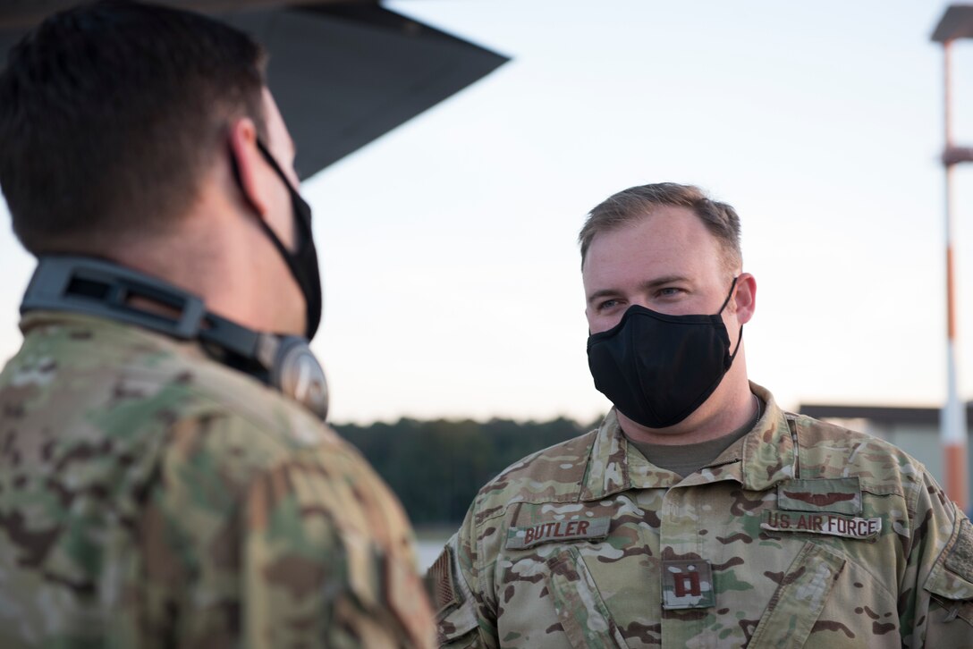 An Airman speaks with another Airman.