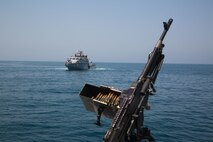 Mark VI patrol craft attached to Commander, Task Force (CTF) 56 maneuver into position to conduct live-fire training in the Arabian Gulf, Sept. 15. CTF 56 is responsible for planning and execution of expeditionary missions, in the U.S. 5th Fleet area of operations and is deployed in support of naval operations to ensure maritime stability and security in the Central Region, connecting the Mediterranean Sea and Pacific Ocean through the Western Indian Ocean and three strategic chokepoints to the free flow of global commerce. (U.S. Army photo by Spc. Joshua DuRant)