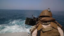 Electronics Technician 3rd Class Bradley Belcher, assigned to Commander, Task Force (CTF) 56, fires an M240 machine gun aboard a Mark VI patrol craft during live-fire training in the Arabian Gulf, Sept. 15, 2020. CTF 56 is responsible for planning and execution of expeditionary missions, in the U.S. 5th Fleet area of operations and is deployed in support of naval operations to ensure maritime stability and security in the Central Region, connecting the Mediterranean Sea and Pacific Ocean through the Western Indian Ocean and three strategic chokepoints to the free flow of global commerce. (U.S. Army photo by Spc. Joshua DuRant)