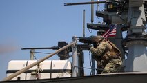 Operations Specialist 1st Class Anthony Darnley, assigned to Commander, Task Force (CTF) 56, fires an M2 .50 caliber machine gun aboard a Mark VI patrol craft during live-fire training in the Arabian Gulf, Sept. 15. CTF 56 is responsible for planning and execution of expeditionary missions, in the U.S. 5th Fleet area of operations and is deployed in support of naval operations to ensure maritime stability and security in the Central Region, connecting the Mediterranean Sea and Pacific Ocean through the Western Indian Ocean and three strategic chokepoints to the free flow of global commerce. (U.S. Army photo by Spc. Joshua DuRant)
