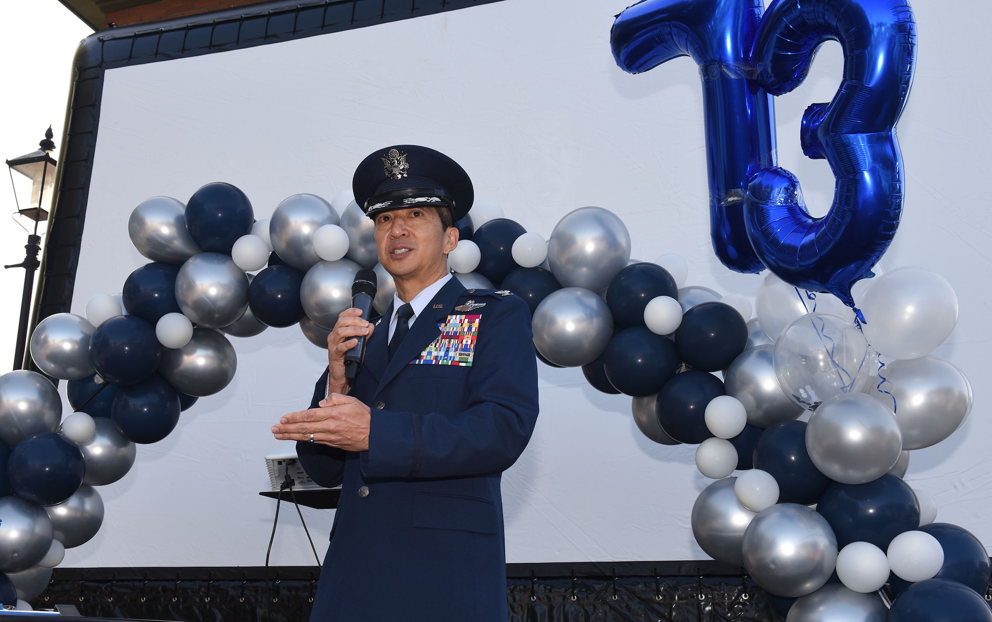 U.S. Air Force Col. Troy Pananon, 100th Air Refueling Wing commander, gives opening remarks at the Air Force “Birthday Bash” event at Royal Air Force Mildenhall, England, Sept. 18, 2020. Events also included a color run and flyover with the Battle of Britain Memorial Flight and RAF’s Red Arrows. (U.S. Air Force photo by Karen Abeyasekere)