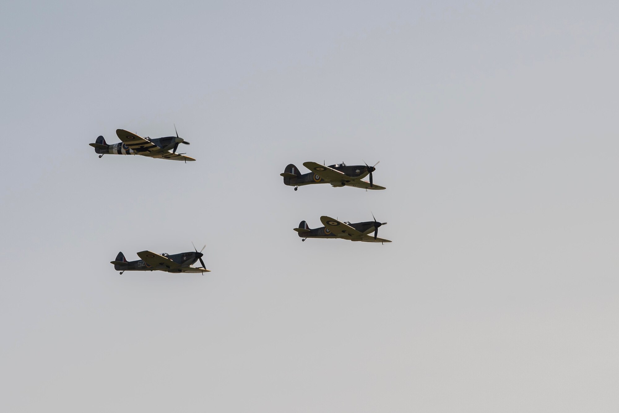Two Royal Air Force Supermarine Spitfires and two RAF Hawker Hurricanes conduct a flyover at RAF Mildenhall, England, Sept. 18, 2020. The flyover was conducted in celebration of the Air Force's 73rd birthday and in commemoration of the 80th anniversary of the Battle of Britain. (U.S. Air Force photo by Airman 1st Class Joseph Barron)
