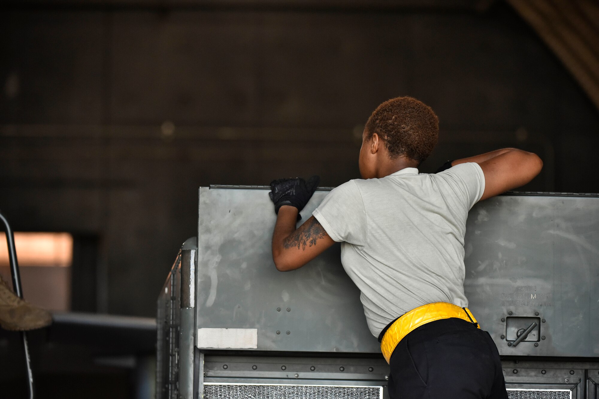 A photo of an Airman inspecting equipment.