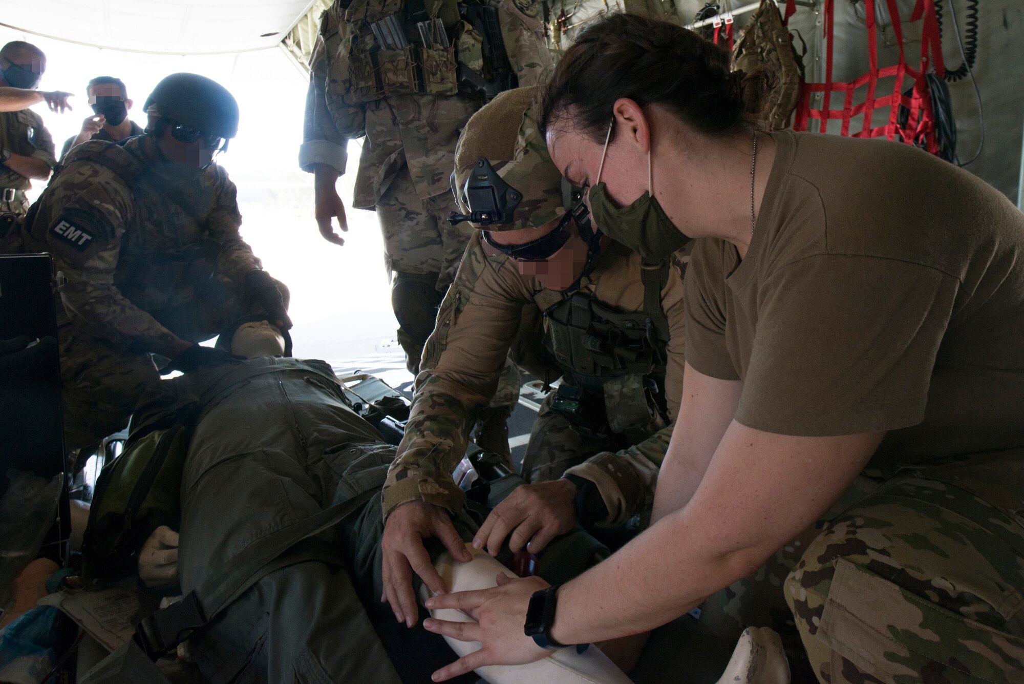 An Airman and a Hellenic forces member tend to a simulated victim.