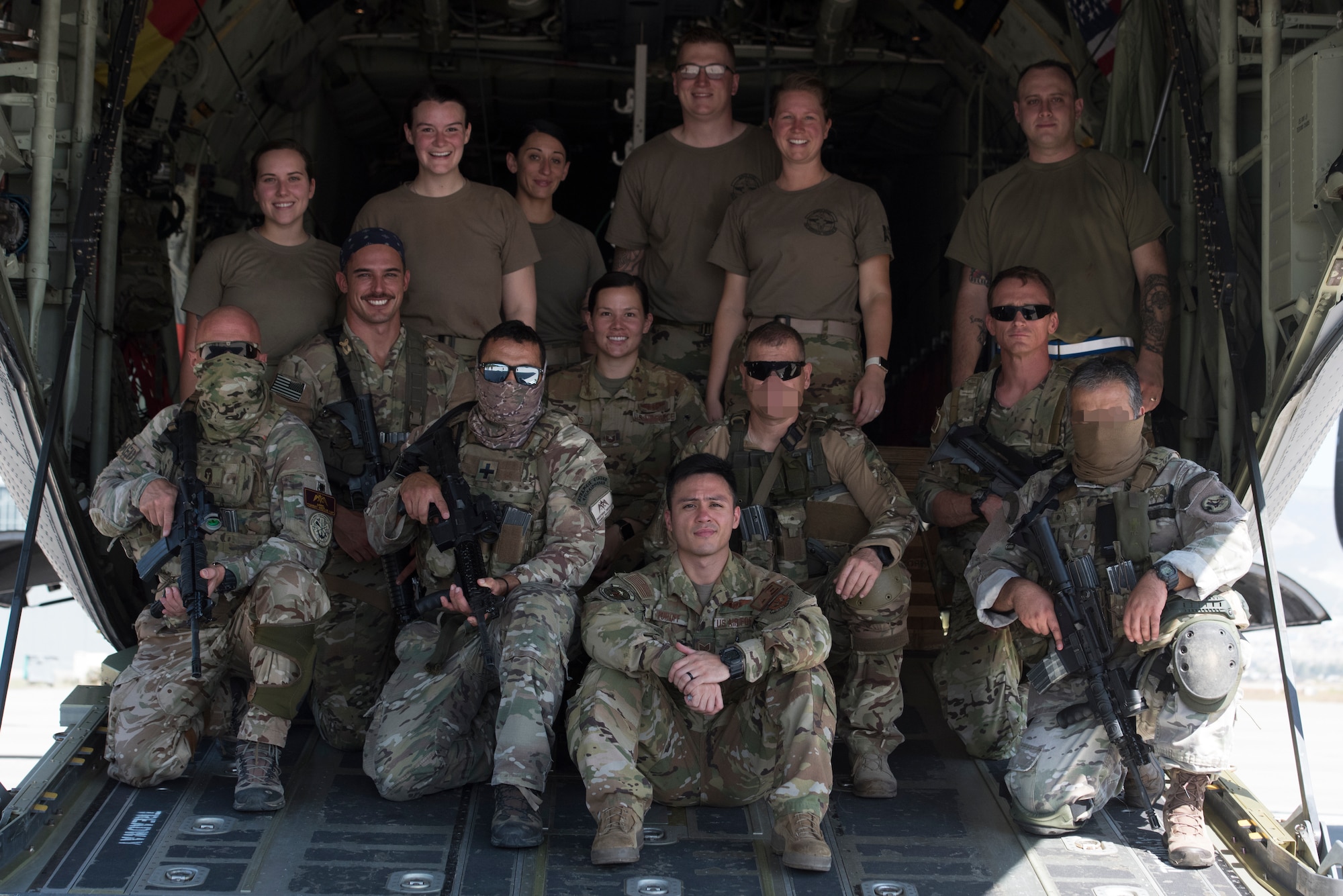 A group of Airmen and Hellenic forces members pose for a photo.