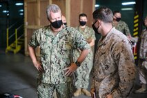 Vice Adm. Samuel Paparo, left, commander of U.S. Naval Forces Central Command (NAVCENT), U.S. 5th Fleet and Combined Maritime Forces, visits with Marines and Sailors from Task Force (TF) 51/5th Marine Expeditionary Brigade on board Naval Support Activity Bahrain, Sept. 20. TF 51/5th, a joint task force-capable headquarters, responds to crises and contingencies, coordinates, plans, and executes operations; conducts theater security cooperation; and advances emerging naval concepts at sea, from the sea, and ashore in order to support U.S. Central Command, NAVCENT and Marine Corps Forces Central Command objectives. (U.S. Marine Corps photo by Staff Sgt. Anne K. Henry)