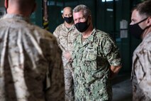 Vice Adm. Samuel Paparo, left, commander of U.S. Naval Forces Central Command (NAVCENT), U.S. 5th Fleet and Combined Maritime Forces, visits with Marines and Sailors from Task Force (TF) 51/5th Marine Expeditionary Brigade on board Naval Support Activity Bahrain, Sept. 20. TF 51/5th, a joint task force-capable headquarters, responds to crises and contingencies, coordinates, plans, and executes operations; conducts theater security cooperation; and advances emerging naval concepts at sea, from the sea, and ashore in order to support U.S. Central Command, NAVCENT and Marine Corps Forces Central Command objectives. (U.S. Marine Corps photo by Staff Sgt. Anne K. Henry)