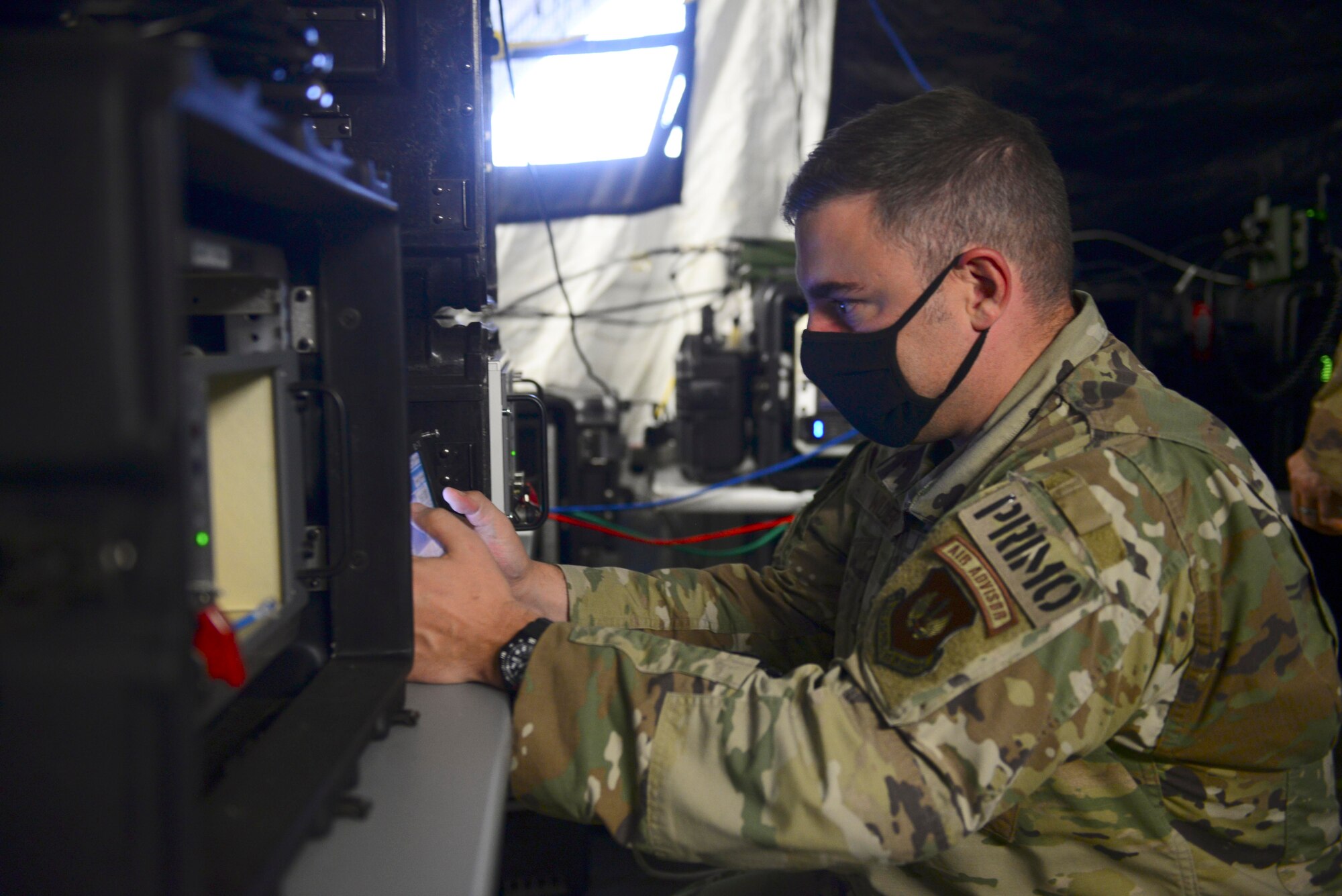 U.S. Air Force Master Sgt. Charles Wilder, 606th Air Control Squadron assistant operations superintendent, manipulates an Ultra High Frequency radio during exercise Astral Knight 20 at Malbork Air Base, Poland, Sept. 22, 2020. Astral Knight 20 is an integrated air and missile defense exercise featuring a combination of flight operations and computer-assisted scenarios. (U.S. Air Force photo by Tech. Sgt. Tory Cusimano)