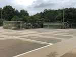 Obsolete containers once needed to protect main rotor blades used on UH-60 Blackhawk helicopters await disposal at the DLA Disposition Services site at Anniston, Alabama.