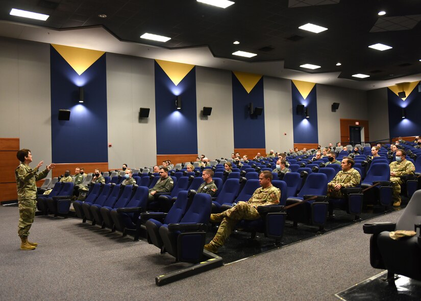 A photo of a general talking to a group of people.