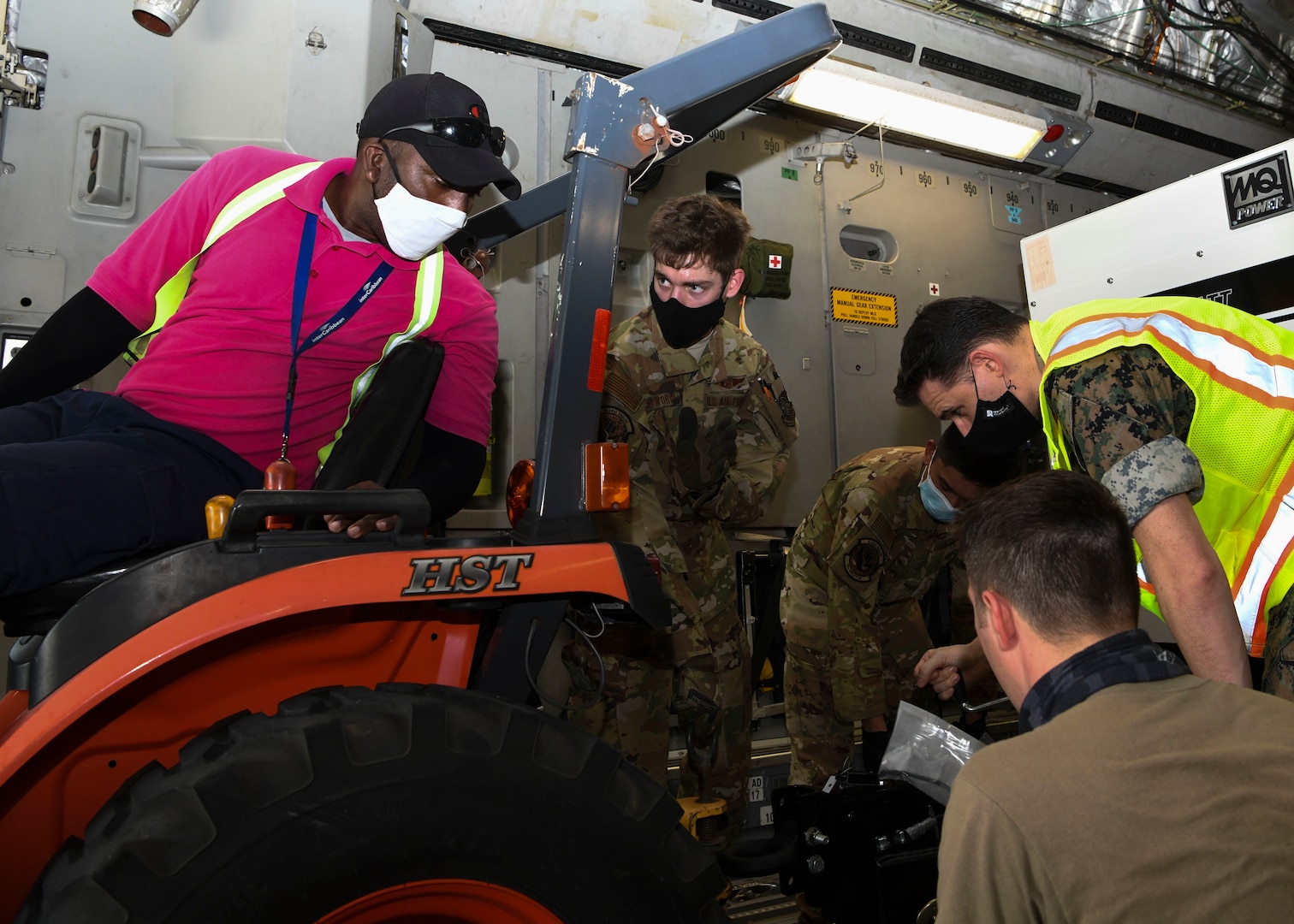 Military personnel offload a mobile field hospital from a C-17 Globemaster III at Norman Manley International Airport in Kingston, Jamaica, Sept. 19, 2020.