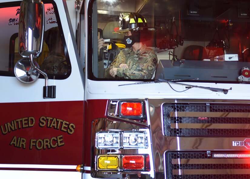 Photo of an individual in a fire truck.