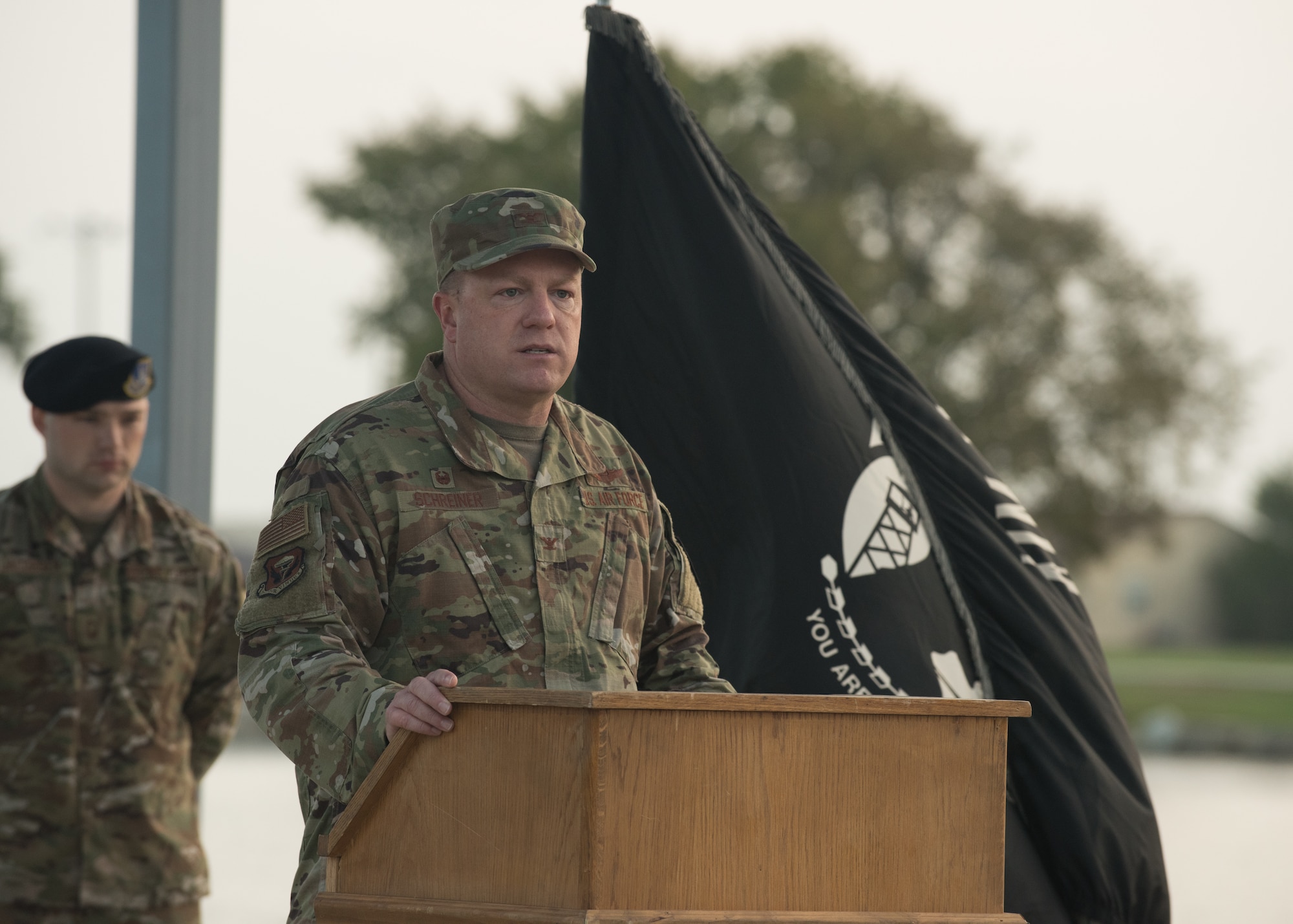 Col. Jeffrey Schreiner, 509th Bomb Wing commander, delivers opening remarks for a 24-hour POW/MIA Remembrance event.