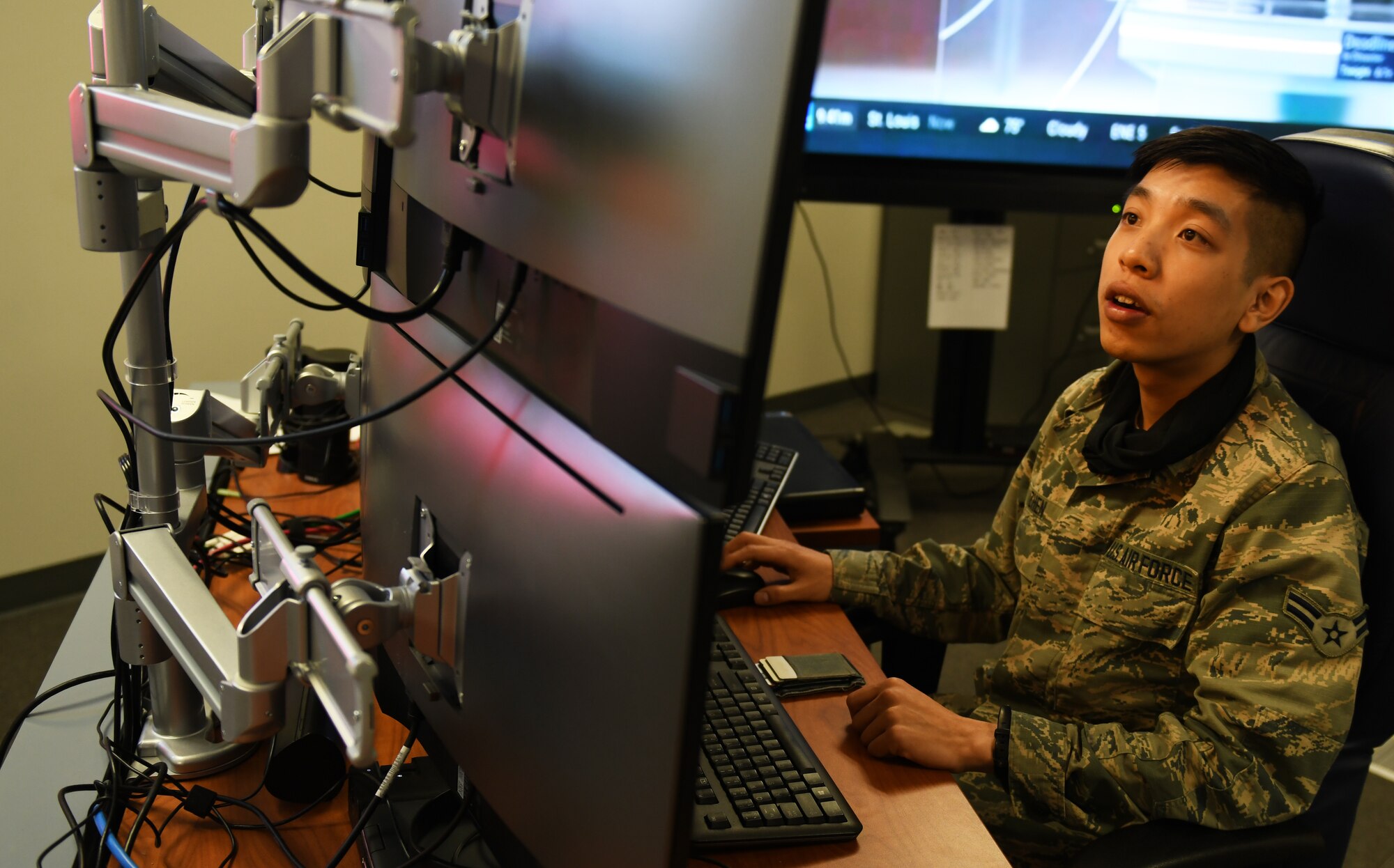 A 62d Cyberspace Squadron Airman monitors his workstation for activity at Buckley Air Force Base, Colo. (U.S. Space Force photo by Staff Sgt. Timothy R. Kirchner)