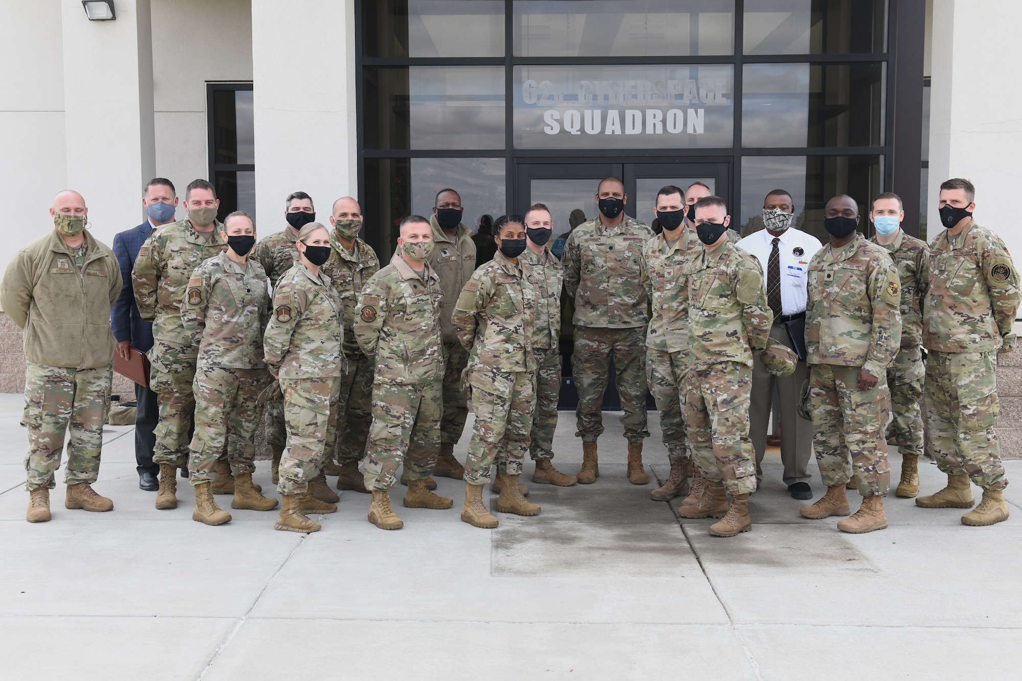 Members from the 62d Cyberspace Squadron pose for a photo outside of building 730 on Buckley Air Force Base, Colo. (U.S. Space Force photo by Staff Sgt. Timothy R. Kirchner)