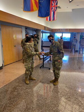 U.S. Air Force Gen. Jacqueline Van Ovost, Air Mobility Command commander visited the 514th Air Mobility Wing, Sept. 22.  Van Ovost coined two star performers during her visit, including Tech. Sgt Nicole Gansert, 78th Air Refueling Squadron and Staff Sgt. Krystin Springerince, 35th Aerial Port Squadron.