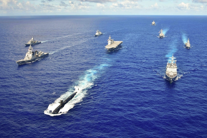 Ships sail in formation.