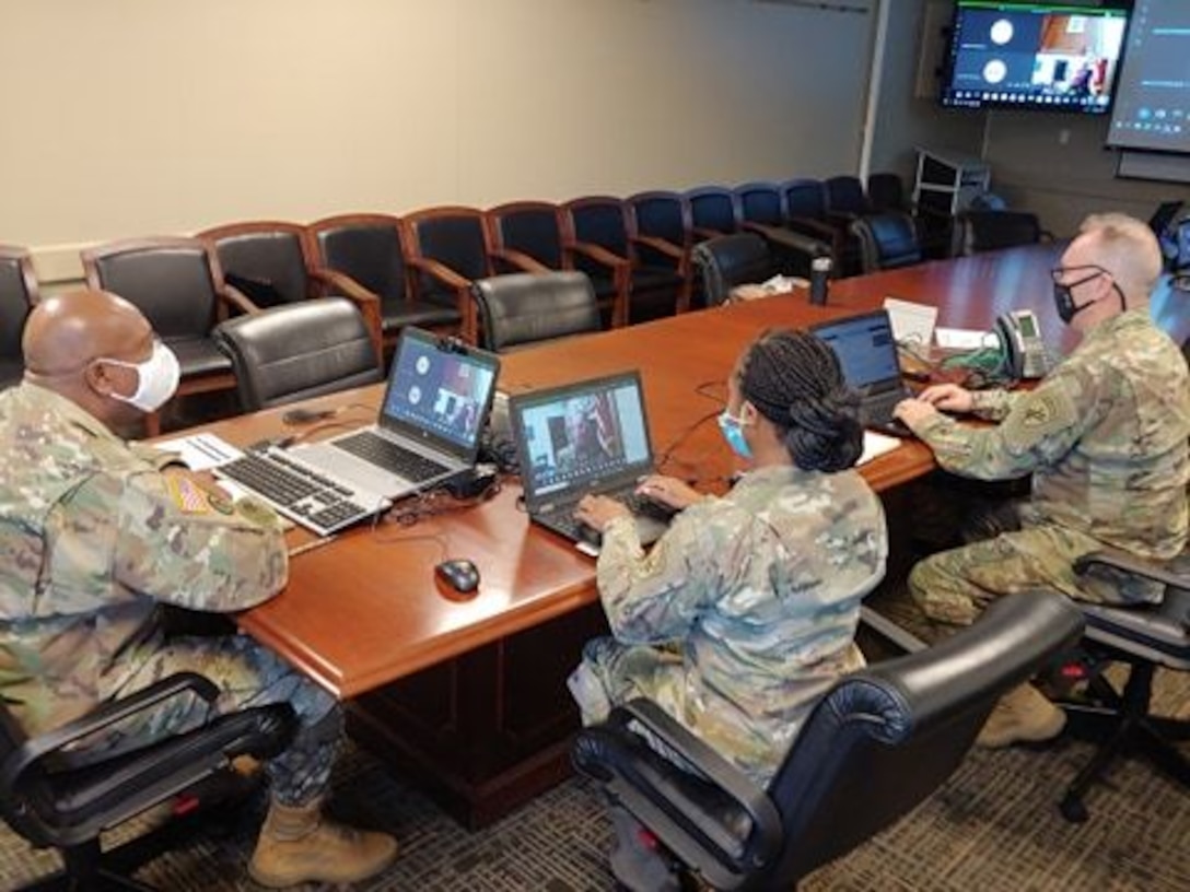 U.S. Army Reserve Lt. Col. Richard James, Sr., command chaplain, Staff Sgt. Monika L. Patterson (center), and Sgt. 1st Class Shawn T. Kilgore (right), religious affairs specialists with the U.S. Army Civil Affairs & Psychological Operations Command, provide network support, coordination, and leadership during mandatory annual Unit Ministry Team (UMT) training for chaplains and religious affairs Soldiers for USACAPOC(A) and its subordinate commands during virtual annual training, Aug. 4 – 7, 2020. USACAPOC(A) ministry teams across the U.S. took part in the advanced UMT training, designed to prepare unit team members with the tools necessary to meet the challenges of working in today’s diffused ministry environment, and enable USACAPOC(A) UMT’s to meet new USARC ministry standards ahead of schedule. (U.S. Army Photo by Maj. Sean D. Delpech)