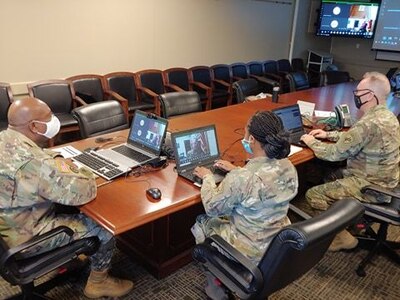 U.S. Army Reserve Lt. Col. Richard James, Sr., command chaplain, Staff Sgt. Monika L. Patterson (center), and Sgt. 1st Class Shawn T. Kilgore (right), religious affairs specialists with the U.S. Army Civil Affairs & Psychological Operations Command, provide network support, coordination, and leadership during mandatory annual Unit Ministry Team (UMT) training for chaplains and religious affairs Soldiers for USACAPOC(A) and its subordinate commands during virtual annual training, Aug. 4 – 7, 2020. USACAPOC(A) ministry teams across the U.S. took part in the advanced UMT training, designed to prepare unit team members with the tools necessary to meet the challenges of working in today’s diffused ministry environment, and enable USACAPOC(A) UMT’s to meet new USARC ministry standards ahead of schedule. (U.S. Army Photo by Maj. Sean D. Delpech)