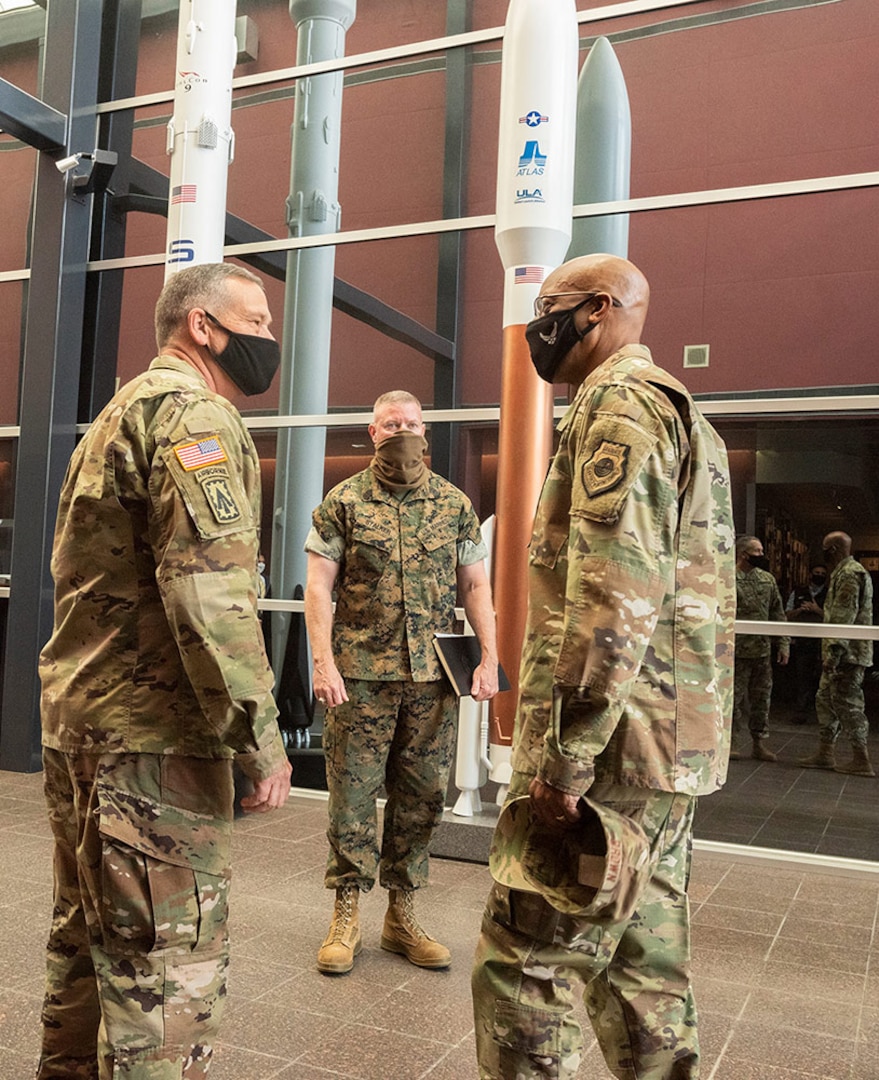 U.S. Army Gen. James Dickinson (left), U.S. Space Command commander, and U.S. Marine Corps Master Gunnery Sgt. Scott Stalker (center), USSPACECOM Command Senior Enlisted Leader, greet Gen. Charles Q. Brown, Jr. (right), United States Air Force Chief of Staff, on Sept. 23 upon the CSAF's arrival at USSPACECOM headquarters at Peterson Air Force Base, Colorado.