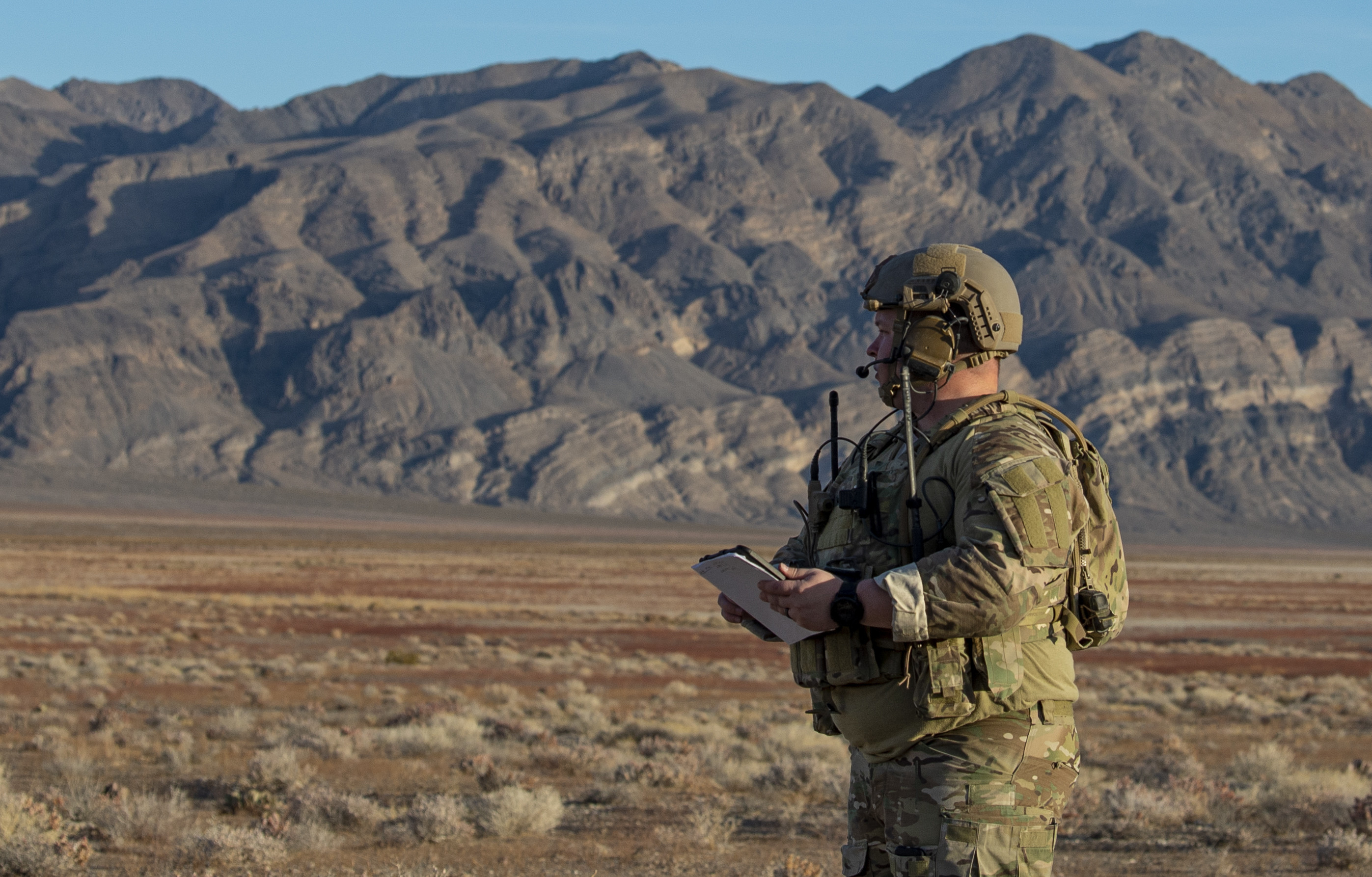 Tech. Sgt. Dennis Back, tactical air control NCO in charge at the 24th Tactical Air Support Squadron looks out at the Nevada Test and Training Range (NTTR) at Nellis Air Force Base, Nevada, Oct. 24, 2019. The NTTR is the largest contiguous air and ground space available for peacetime military operations in the free world. The range occupies 2.9 million acres of land, 5,000 square miles of airspace which is restricted from civilian air traffic over-flight and another 7,000 square miles of military operating area. (U.S. Air Force photo by Airman 1st Class Dwane R. Young)
