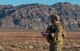 Airman stands in the middle of a range.