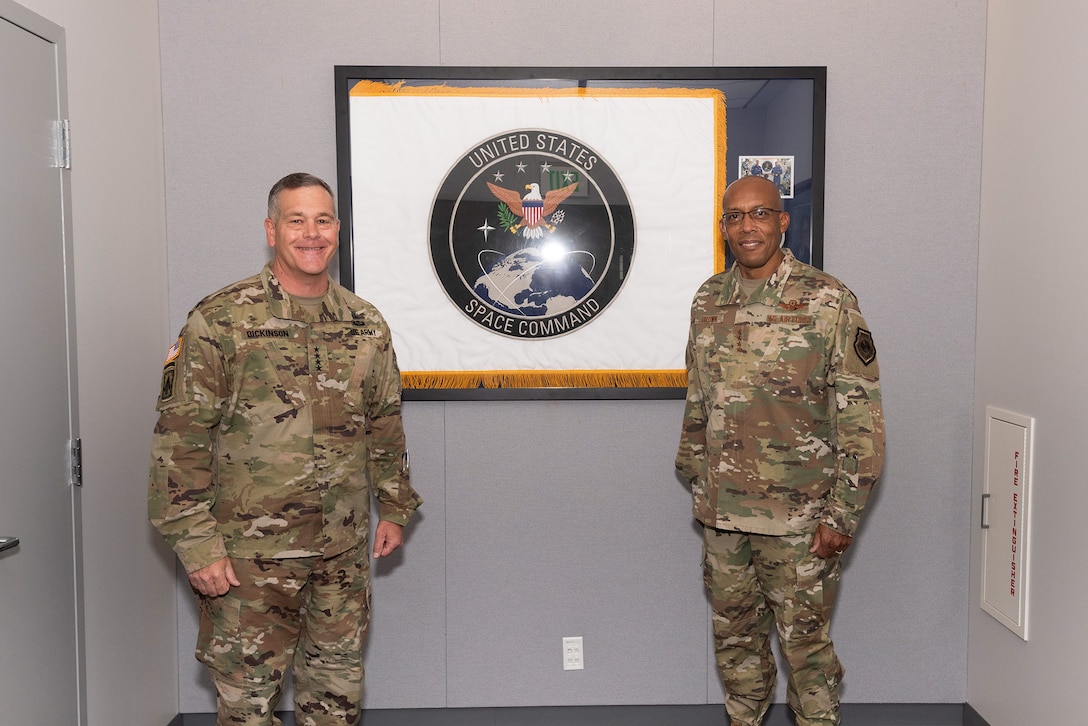 Gen. Charles Q. Brown, Jr. (right), United States Air Force Chief of Staff, and U.S. Army Gen. James Dickinson (left), U.S. Space Command commander, pose for a photo at USSPACECOM headquarters Sept. 23 at Peterson Air Force Base, Colorado.