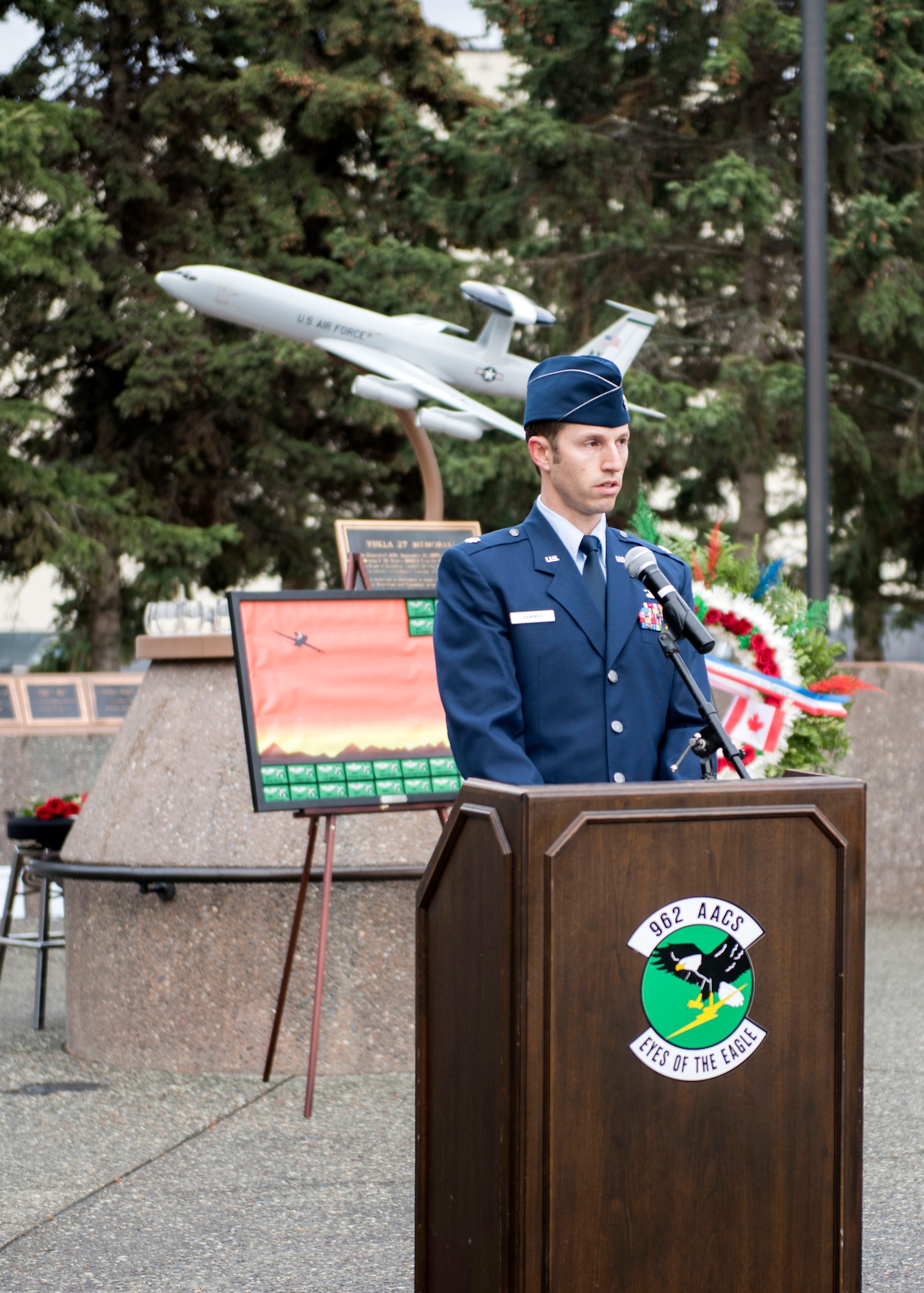 U.S. Air Force Lt. Col. Clint Hammer, 962nd Airborne Air Control Squadron director of operations, speaks at the Yukla 27 25th anniversary memorial ceremony at Joint Base Elmendorf-Richardson, Alaska, Sept. 22, 2020. Yukla 27, a U.S. Air Force E-3 Sentry airborne warning and control system aircraft assigned to the 962nd AACS, encountered a flock of geese Sept. 22, 1995, and crashed shortly after takeoff on a routine surveillance training sortie, killing all 24 Canadian and U.S. Airmen aboard.
