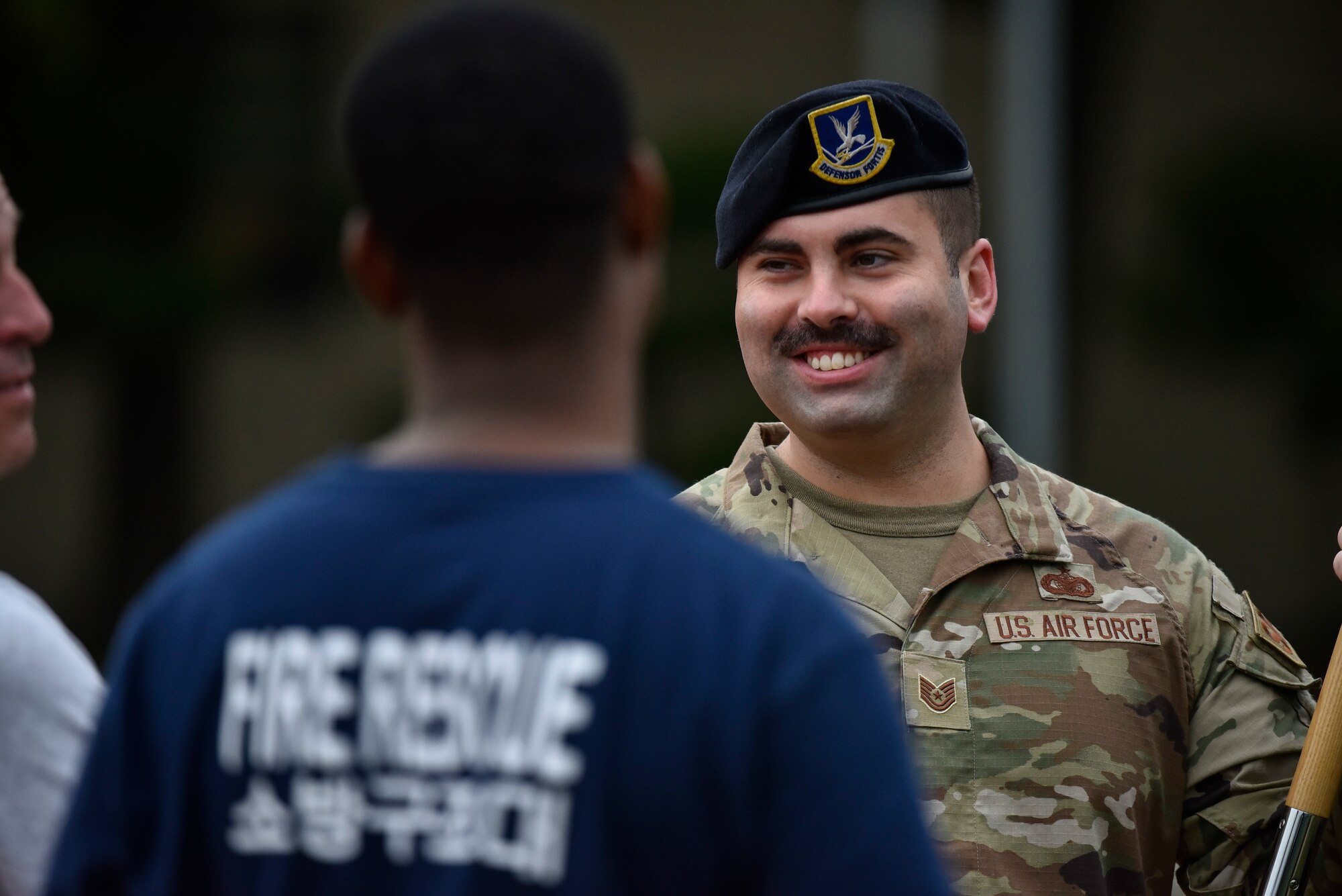 A photo of an Airman speaking.