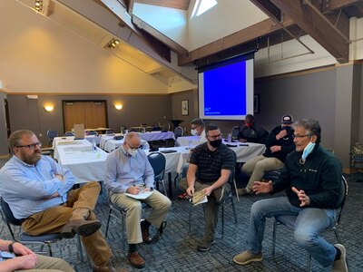 U.S. Army Reserve Lt. Col. Eric Christeson (2nd from right), and Maj. Brian Hancock (2nd from left), from the 351st Civil Affairs Command Functional Specialty Team (FxSP) take part in a Governance Round Table with Community Stakeholders and Qawalangin Tribe (Q-Tribe) Tribal Council members during the Innovative Readiness Training Civil-Military Partnership Subject Matter Expert Assessment, Aug. 24, 2020. IRT is a joint training concept that the Department of Defense (DOD) implemented to increase unit deployment readiness, leveraging the military contributions of U.S. Armed Forces capabilities, combined with local resources to build strong civil-military partnerships for communities in the contiguous United States and its territories.