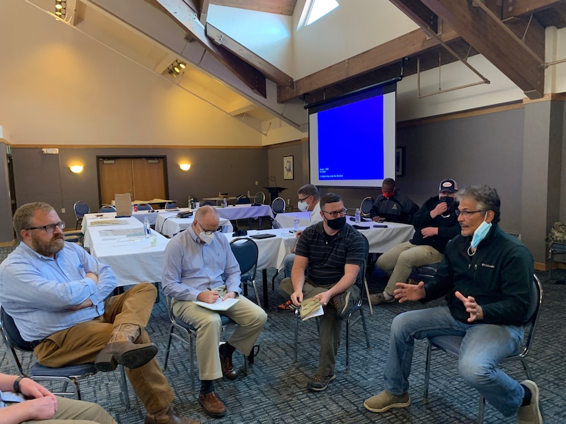 U.S. Army Reserve Lt. Col. Eric Christeson (2nd from right), and Maj. Brian Hancock (2nd from left), from the 351st Civil Affairs Command Functional Specialty Team (FxSP) take part in a Governance Round Table with Community Stakeholders and Qawalangin Tribe (Q-Tribe) Tribal Council members during the Innovative Readiness Training Civil-Military Partnership Subject Matter Expert Assessment, Aug. 24, 2020. IRT is a joint training concept that the Department of Defense (DOD) implemented to increase unit deployment readiness, leveraging the military contributions of U.S. Armed Forces capabilities, combined with local resources to build strong civil-military partnerships for communities in the contiguous United States and its territories.