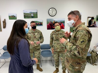 U.S. Army Reserve Lt. Col. Eric Christeson (2nd from left), Maj. Tulsi Gabbard (center), and Lt. Col. Hugh Dougalas Governance team members from the 351st Civil Affairs Command Functional Specialty Team (FxSP) engage with a Qawalangin Tribe (Q-Tribe) Young Leader during the Innovative Readiness Training Civil-Military Partnership Subject Matter Expert Assessment, Aug. 25, 2020. IRT is a joint training concept that the Department of Defense (DOD) implemented to increase unit deployment readiness, leveraging the military contributions of U.S. Armed Forces capabilities, combined with local resources to build strong civil-military partnerships for communities in the contiguous United States and its territories.