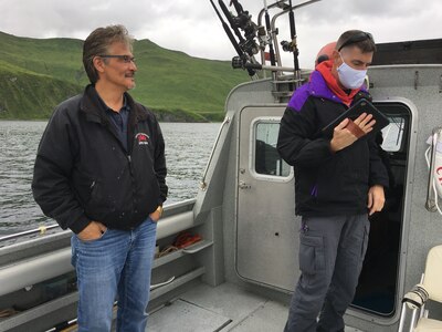 Mr. Tom Robinson, Qawalangin Tribe (Q-Tribe) Council President (left), and U.S. Army Reserve Lt. Col. Hugh Dougalas, governance and participation section chief (right), engage in a team building exercise, observing environmental conditions in Unalaska Bay, Alaska, during an Innovative Readiness Training Civil-Military Partnership Leader’s Reconnaissance, July 24, 2020. IRT is a joint training concept that the Department of Defense (DOD) implemented to increase unit deployment readiness, leveraging the military contributions of U.S. Armed Forces capabilities, combined with local resources to build strong civil-military partnerships for communities in the contiguous United States and its territories.