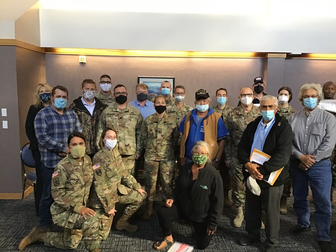 U.S. Army Reserve Soldiers from the 351st Civil Affairs Command Functional Specialty Team (FxSP) pose for a photo with Unalaska, Alaska community stakeholders during the Innovative Readiness Training Civil-Military Partnership Subject Matter Expert Assessment, Unalaska, Alasks, Aug. 27, 2020. IRT is a joint training concept that the Department of Defense (DOD) implemented to increase unit deployment readiness, leveraging the military contributions of U.S. Armed Forces capabilities, combined with local resources to build strong civil-military partnerships for communities in the contiguous United States and its territories.