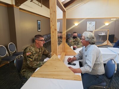 U.S. Army Reserve Lt. Col. Hugh Dougalas, (left), and Lt. Col. Eric Christeson (right) from the 351st Civil Affairs Command Functional Specialty Team (FxSP) conduct Key Leader Engagement (KLE) with local business professional, Mr. Dennis Robinson, during the Innovative Readiness Training Civil-Military Partnership Subject Matter Expert Assessment, Aug. 24, 2020. IRT is a joint training concept that the Department of Defense (DOD) implemented to increase unit deployment readiness, leveraging the military contributions of U.S. Armed Forces capabilities, combined with local resources to build strong civil-military partnerships for communities in the contiguous United States and its territories.