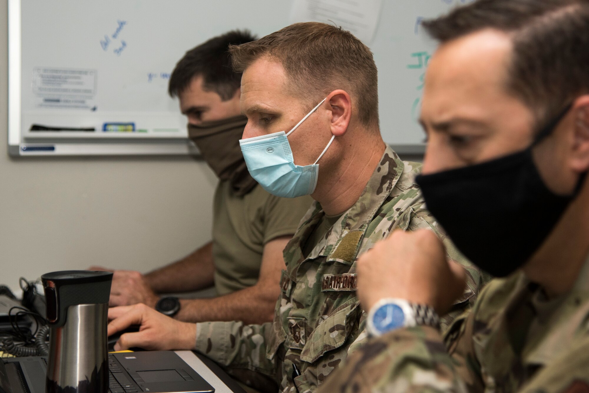 Guardsmen from the 142nd Wing work in the Emergency Operation Center in support of Operation Plan Smokey at the Portland Air National Guard Base, Ore., Sept. 18, 2020. The EOC is responsible for provinding command and control during emergency events, such as the Oregon wildfires. (U.S. Air National Guard photo by Senior Airman Valerie R. Seelye)