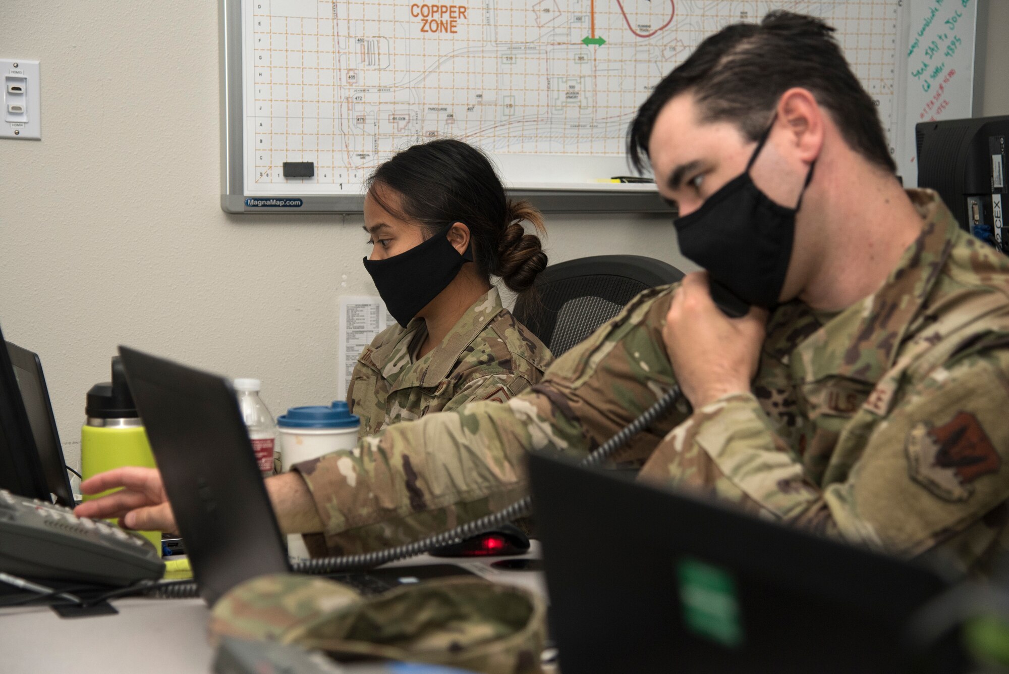 Guardsmen from the 142nd Wing work in the Emergency Operation Center in support of Operation Plan Smokey at the Portland Air National Guard Base, Ore.,  Sept. 18, 2020. The EOC team communicates with the Oregon Joint Operation Center to provide emergency management for scenarios such as the state's recent wildfires. (U.S. Air National Guard photo by Senior Airman Valerie R. Seelye)